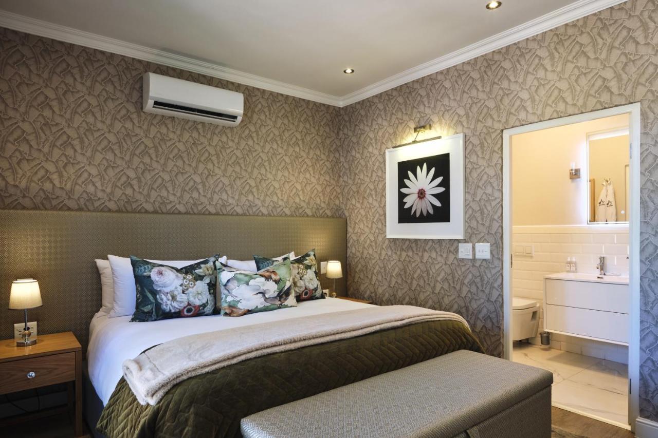 Alluvia Boutique Winery & Luxury Accommodation Stellenbosch Luaran gambar A bedroom at the Cape Heritage